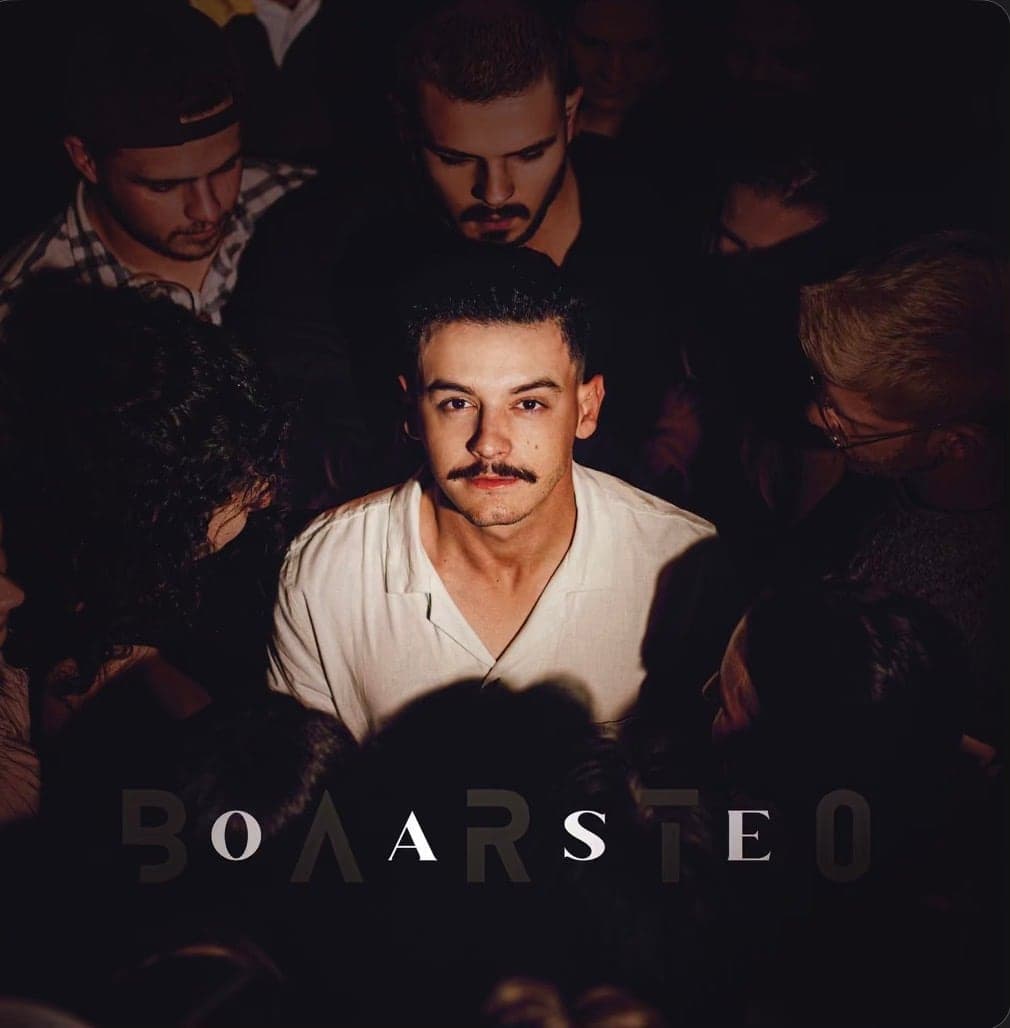 Cover artwork, a band portrait in low light